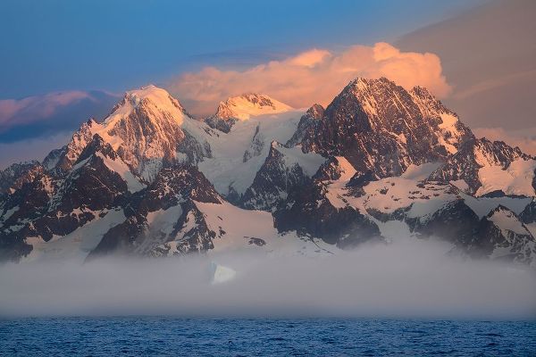 Antarctica-South Georgia Island-Coopers Bay Iceberg and mountains at sunrise